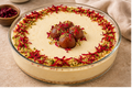 The Tea Room Gulab Jamun Cheesecake whole cake with pistachios and rose petals