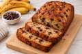 Honey Banana Chip Loaf sliced on wooden board